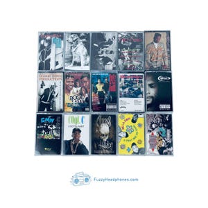 May include: A collection of fifteen vintage cassette tapes, featuring album art with various designs and colors. The tapes showcase a variety of musical artists and genres, with some featuring explicit content warnings. The image includes the website FuzzyHeadphones.com.