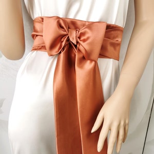 May include: A rustic wooden sign with the text "Welcome to our home" in a handwritten style. The sign has a distressed finish and a simple, inviting design, ideal for a front porch or entryway.