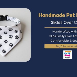 a handmade pet bandana with a white background and black paw prints. The bandana has a black collar and is described as a "Slides Over Collar" designed for dogs.