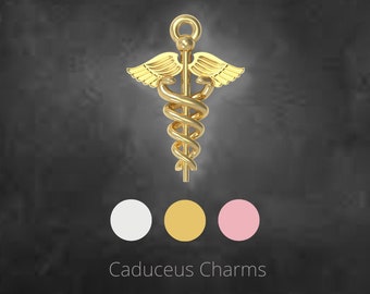 May include: A gold-colored caduceus charm with wings and a serpent entwined around a staff. The charm is displayed against a dark gray background with three color swatches and the text "Caduceus Charms".