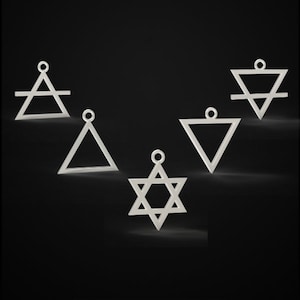 May include: Five silver-colored pendants with geometric shapes, including triangles, a Star of David, and symbols representing the elements. Each pendant has a small loop at the top for hanging. The pendants are set against a dark background.