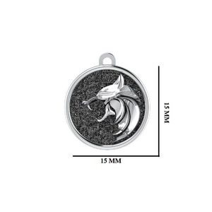 May include: A silver pendant featuring a wolf head design. The round pendant is 15 mm in diameter, with a textured black background. The wolf head is detailed and snarling, with a loop for a chain. The pendant is approximately 0.6 inches.