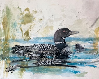 May include: Watercolor painting of a loon swimming in a lake with a small loon behind it. The background is a soft wash of green and blue.
