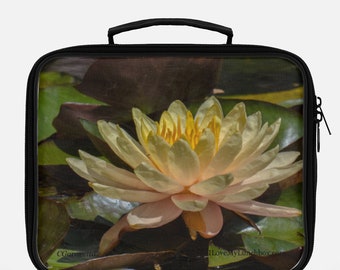Yellow Lotus Blossom in a pond, photo on a Lunch Box Tote Bag