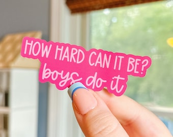 May include: Pink sticker with the text "HOW HARD CAN IT BE? boys do it" in white lettering.