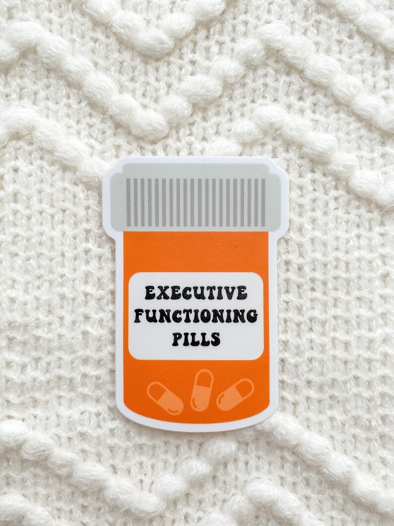 May include: Orange pill bottle sticker with the text "Executive Functioning Pills" and three white pills inside.