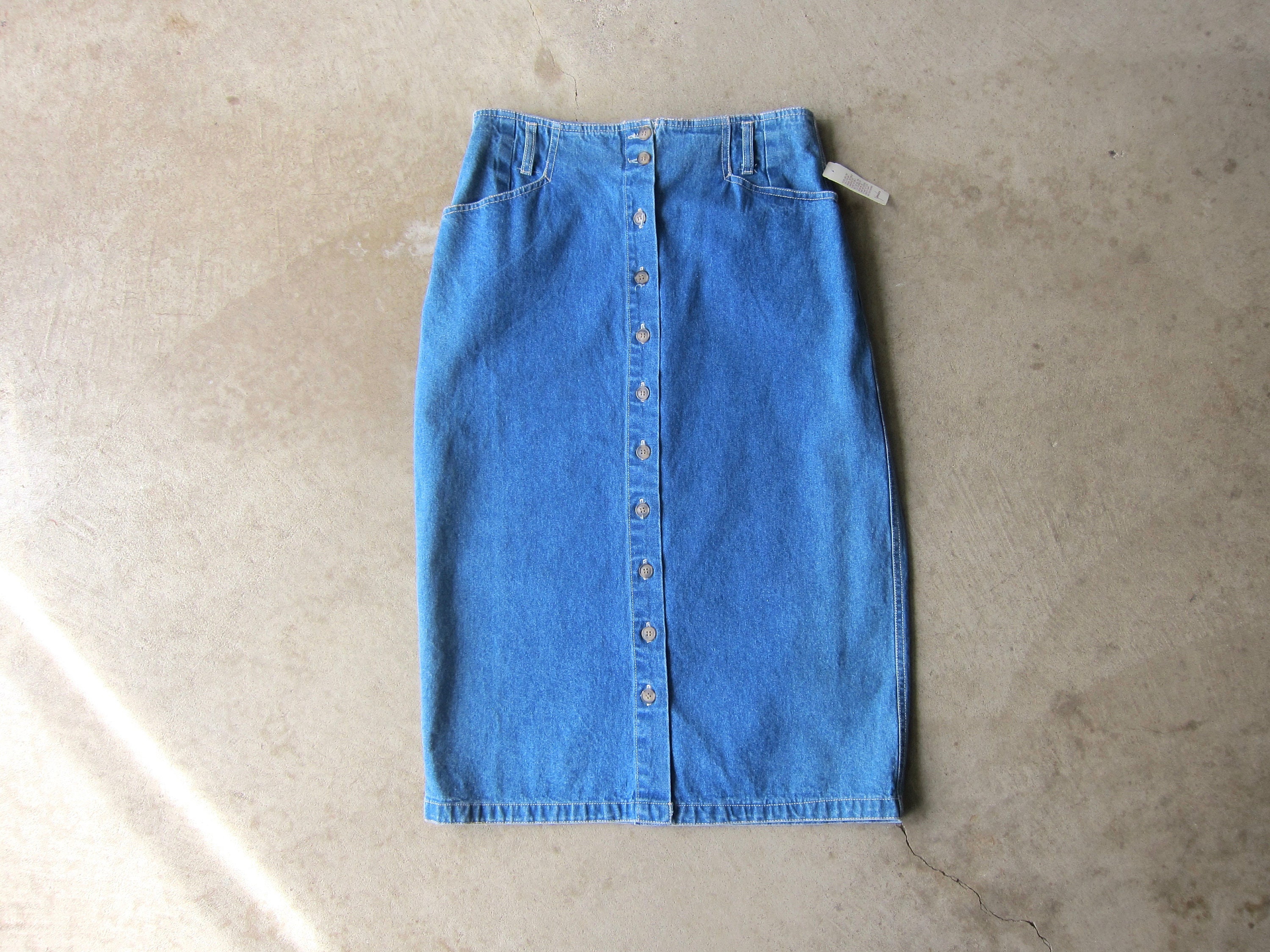 Knee length denim skirt with cheap buttons