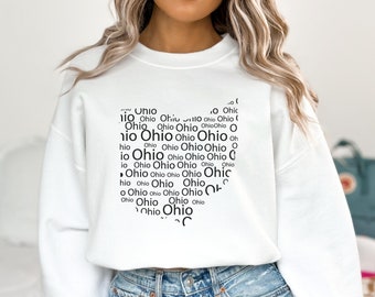 May include: White cropped sweatshirt with a black graphic print of the word "Ohio" repeated multiple times.