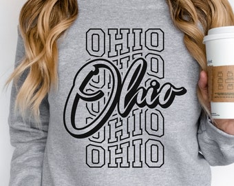 May include: A grey sweatshirt with a black graphic design that says "Ohio" in a stylised font. The word "Ohio" is repeated multiple times in a smaller font around the main graphic. The sweatshirt is labelled "Sport Grey".