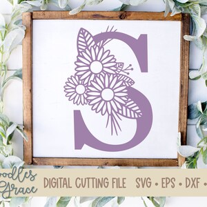 May include: A purple letter S with a floral design. The letter is surrounded by stylized flowers and leaves. The image includes the text "Doodles + Grace DIGITAL CUTTING FILE SVG - EPS - DXF - PNG".
