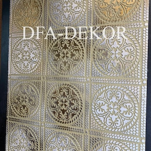 May include: Close-up of a decorative panel with a repeating pattern of gold and silver circular designs. The designs are framed by a gold lattice pattern. The text "DFA-DEKOR" is printed in white across the panel.