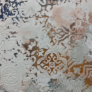 May include: Abstract artwork with a textured surface. The design features white, raised patterns against a backdrop of muted colors, including blue, orange, and pink. The patterns include floral and geometric shapes.