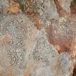 May include: Abstract art piece with a textured surface featuring circular, ornate patterns in shades of gray, brown, and gold. The design has a distressed, aged appearance, with visible brushstrokes and color variations, creating a vintage aesthetic.