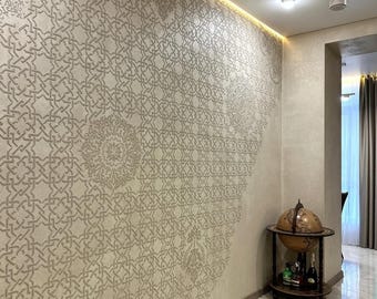 May include: A beige wall with a repeating geometric pattern and circular designs. A decorative globe on a dark wooden stand with a lower shelf is in the corner. The room has recessed lighting.