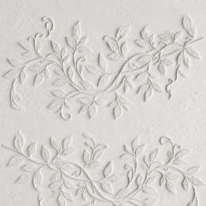 May include: A white wall panel featuring a raised, three-dimensional relief of sprawling leafy vines. The design consists of two horizontal sections of interconnected branches and foliage, all rendered in a monochromatic matte white finish.