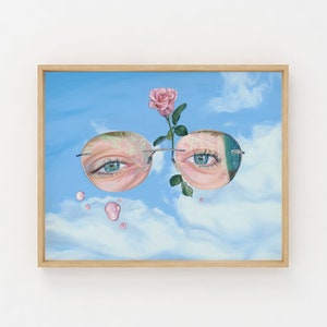 May include: A painting of a pair of round glasses with a pink rose and blue sky in the background. The glasses are reflecting the eyes of a person, and there are small pink drops of water in the air.