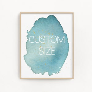 以下が含まれることがあります： ターコイズ色の水彩デザインと金色の斑点が入った、額装されたアートプリント。「CUSTOM SIZE」の文字が白で表示されています。アートワークは白い背景に配置されています。