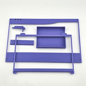 May include: A set of purple 3D printed components including a large rectangular frame, a smaller rectangular frame, a rectangular tray, a long flat bar, and a small L-shaped bracket. These modular plastic parts feature smooth surfaces and clean edges.