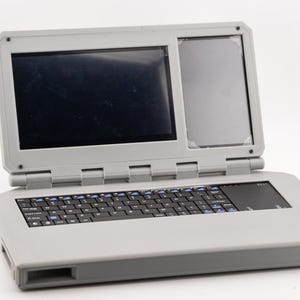 Base de estación de trabajo portátil para Raspberry Pi. Compatible con dos pantallas táctiles y teclado inalámbrico.