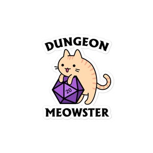 Può includere: Un gatto arancione carino che tiene un dado a 20 facce viola con il testo "Dungeon Meowster" sopra e sotto il gatto.