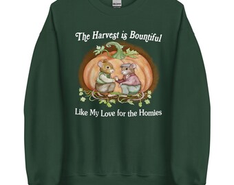 May include: Dark green sweatshirt with a whimsical illustration of two mice holding hands in front of a pumpkin. The text reads "The Harvest is Bountiful" and "Like My Love for the Homies" in white script.