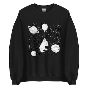 May include: Black sweatshirt with a white graphic of a bear holding a balloon in space. The graphic includes planets and stars.