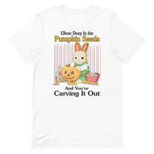 May include: White t-shirt with a cartoon bunny carving a pumpkin. The text reads "Elbow Deep in the Pumpkin Seeds And You're Carving It Out."