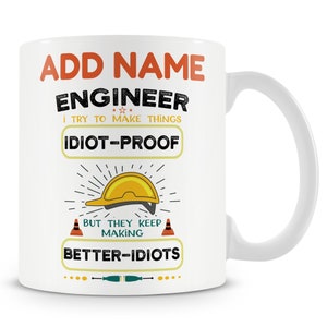 May include: White ceramic coffee mug with a yellow and orange design. The mug features the text "ADD NAME ENGINEER I TRY TO MAKE THINGS IDIOT-PROOF BUT THEY KEEP MAKING BETTER-IDIOTS".