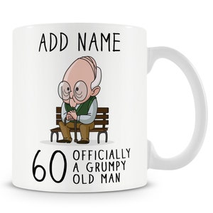 May include: White ceramic mug featuring a cartoon illustration of an older person sitting on a bench. The mug has the text "ADD NAME" at the top and "60 OFFICIALLY A GRUMPY OLD MAN" at the bottom.