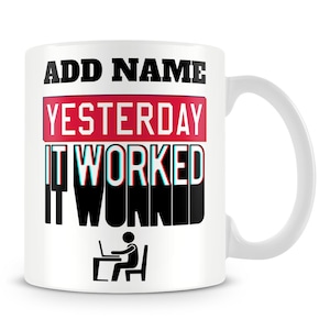 May include: White ceramic mug with black text that reads "ADD NAME YESTERDAY IT WORKED IT WORKED". The text "YESTERDAY" is in a red box. A black stick figure is sitting at a desk with a laptop.
