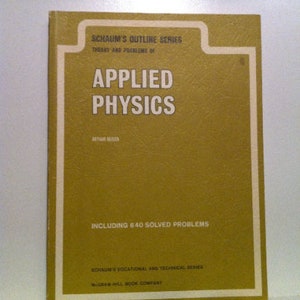 May include: A yellow and white book cover with the title "Schaum's Outline Series Theory and Problems of Applied Physics" and the text "Including 640 Solved Problems".