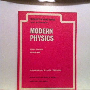 May include: A red book cover with the title "Modern Physics" in white text. The book is part of Schaum's Outline Series and includes 486 solved problems. The authors are Ronald Gautreau and William Savin.