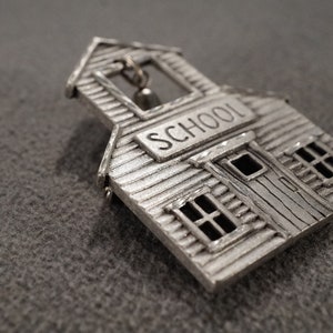vintage antique silver tone pin brooch in the form of a one-room schoolhouse, details include school bell, 2 x 1 1/2 inches  **M1