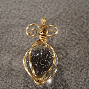 vintage 12K gold filled pendant charm that traps a large round white glass bead and an incorporated bale, 1 1/2 x 3/4 inches  **M2