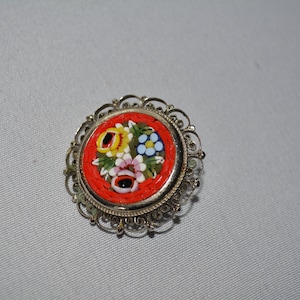 antique pin brooch with Italian micro mosaic styling of Venitian Murano Art Glass in reds yellow and blue  1 1/4 inch diameter **M4