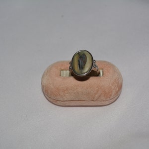 vintage silver tone statement ring set with large oval mother-of-pearl stone in a decorative setting, adjustable size 5  **M10