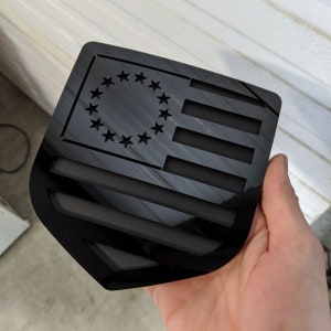 Betsy Ross American Flag Badge - Fits 2009-2018 Dodge® Ram® Tailgate -1500, 2500, 3500 - Gloss Black on Matte Black