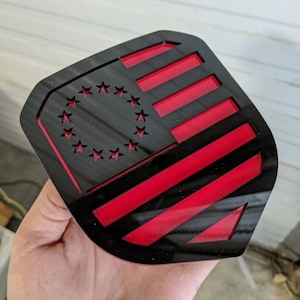 Betsy Ross American Flag Badge - Fits 2013-2018 Dodge® Ram® Grille -1500, 2500, 3500 - Gloss Black on Red