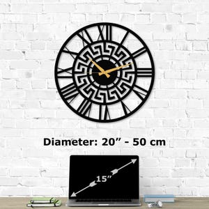 Size guide infographic for Metal Wall Clock with a Flower of Life design on a white brick wall. Image text shows 'Diameter:  20 inch - 50 cm' compared to a 15-inch laptop on a desk. Sacred Geometry Decor by Degary.