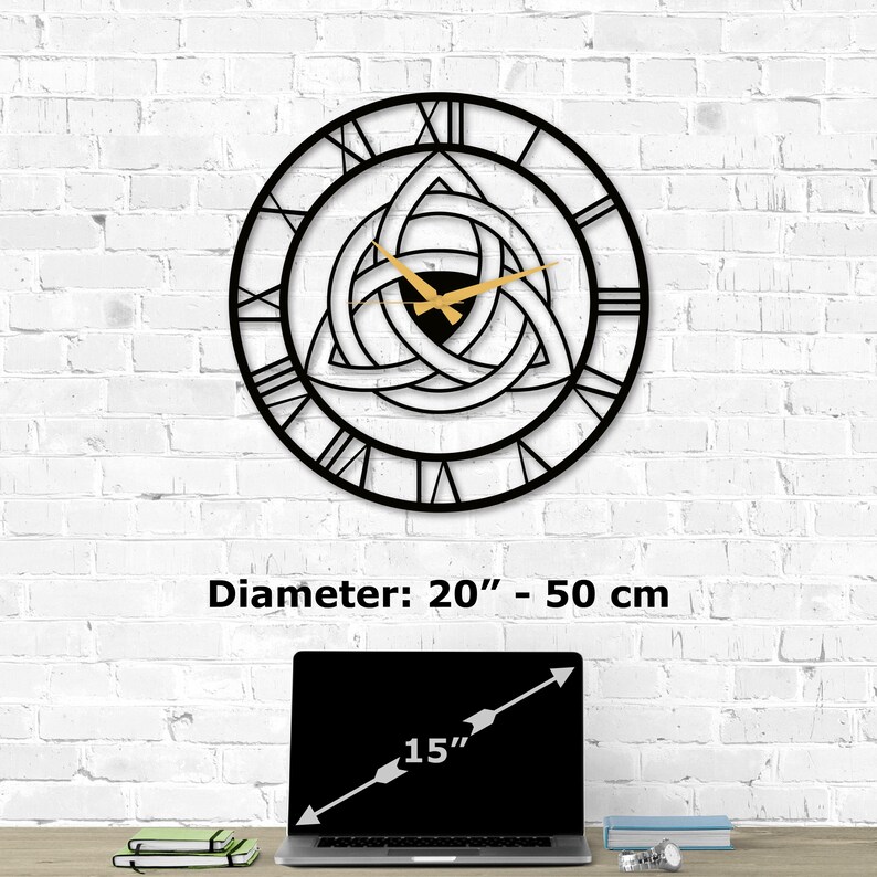 Size guide infographic for Metal Wall Clock with Triquetra design on a white brick wall. Image text shows 'Diameter:  20 inch - 50 cm' compared to a 15-inch laptop on a desk.