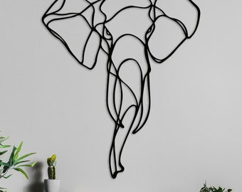Pode incluir: Escultura de parede de metal preto de uma cabeça de elefante, criada com uma única linha contínua.