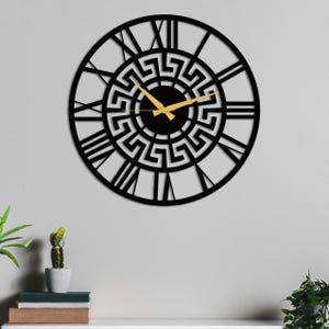 Large Meander metal wall clock featuring an ancient Greek key pattern, modern black steel decorative wall art for home or office decor.