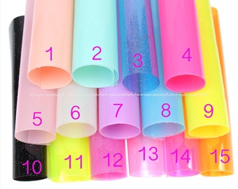 May include: Fifteen rolls of vinyl adhesive film in various colours, including black, pink, yellow, blue, and green. The rolls are numbered 1 through 15.