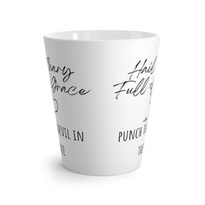 May include: White ceramic mug with black text that reads "Hail Mary Full of Grace" and "Punch the Devil in the Face".