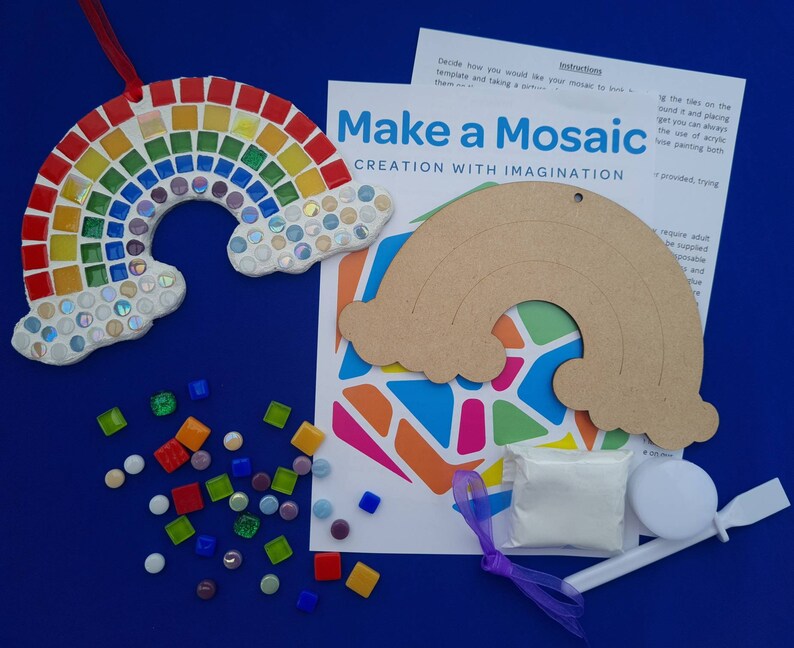 May include: A rainbow mosaic craft kit with a wooden rainbow template, colorful mosaic tiles, glue, and a spreader. The kit includes instructions for creating a mosaic rainbow.