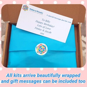 May include: A blue gift box with a white card that says "Make a Mosaic" and a personalized message for Billy. The card says "To Billy Happy Birthday! Lots of Love Finlay & Jacob xxx".