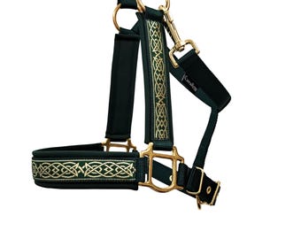 May include: A dark green horse halter with gold-colored hardware and decorative gold embroidery. The halter features a padded noseband and a snap closure. The brand name "Cavallini" is visible on the side.