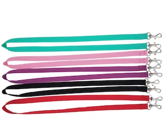May include: Set of six colorful lanyard straps with silver swivel clasps. The straps are in the colors teal, pink, purple, black, and red.