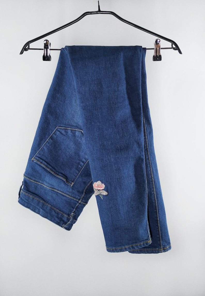 Vintage blue jeans with floral embroidery