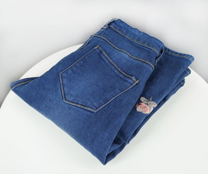 Vintage blue jeans with floral embroidery